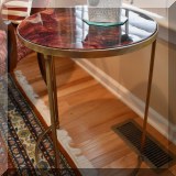 F10. Round nesting table. 24”h x 19” 